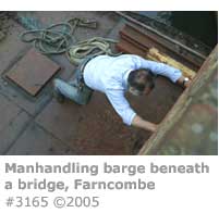 MANHANDLING BARGE BENEATH A BRIDGE