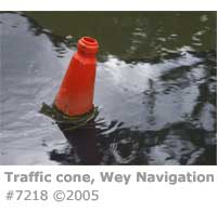 TRAFFIC CONE IN RIVER